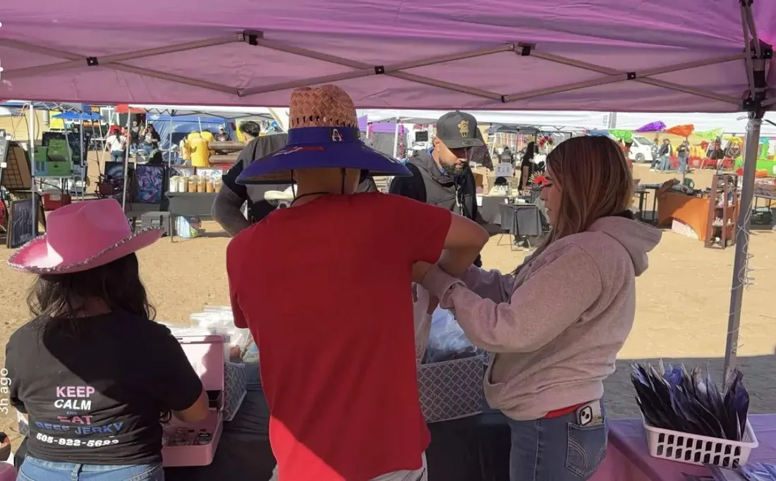 Jerky Fixx crew serving customers at the booth
