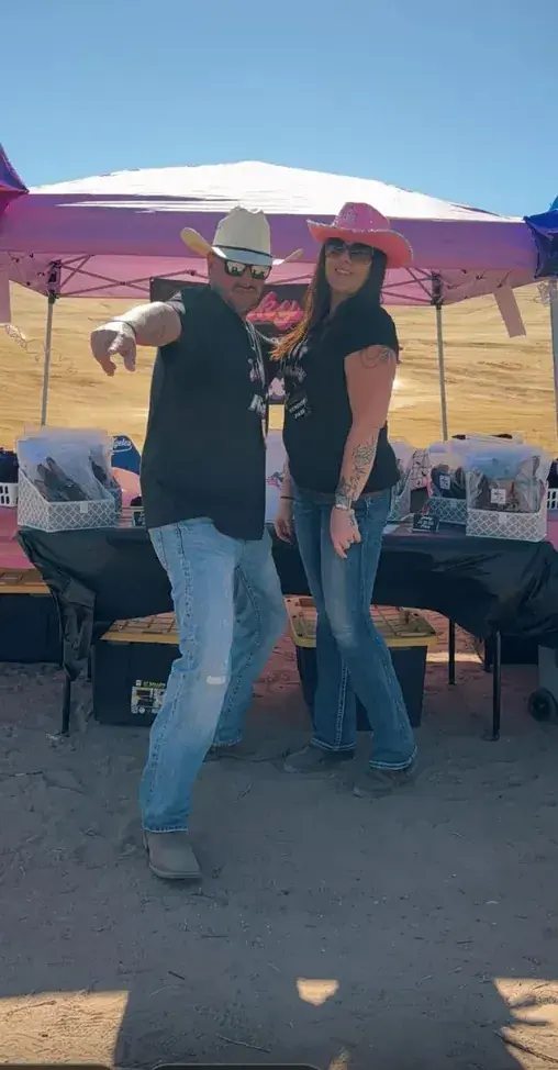 Two Jerky Fixx family members posing at the booth